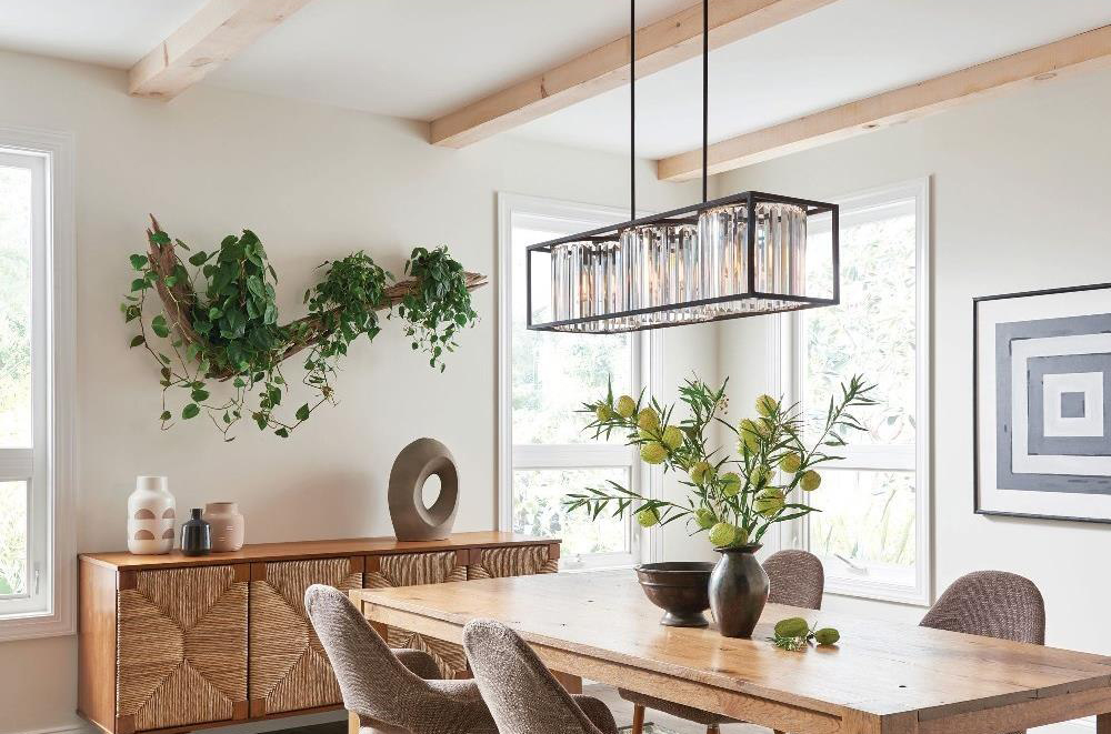 one 3 light crystal chandelier hanging over dining room table